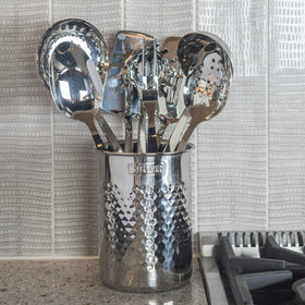 Viking stainless steel kitchen organizer keeps tools accessible while protecting counters.
