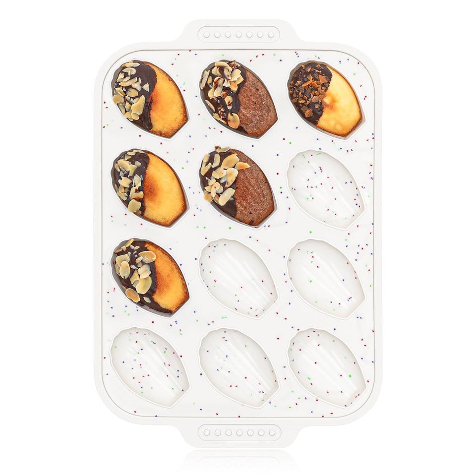 Vinino 12-cavity shell pattern madeleine pan for even browning.