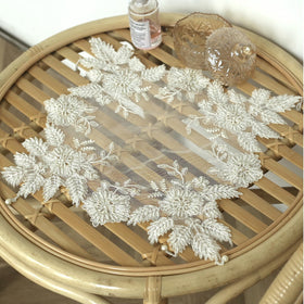 VIRFONOR lace doilies on a coffee table as a vase mat and centerpiece accent