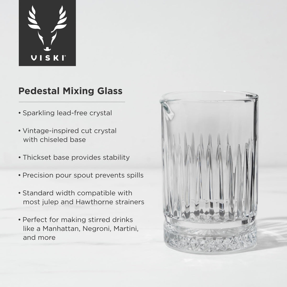 Viski crystal mixing glass with sturdy pedestal base provides stable one-handed stirring.