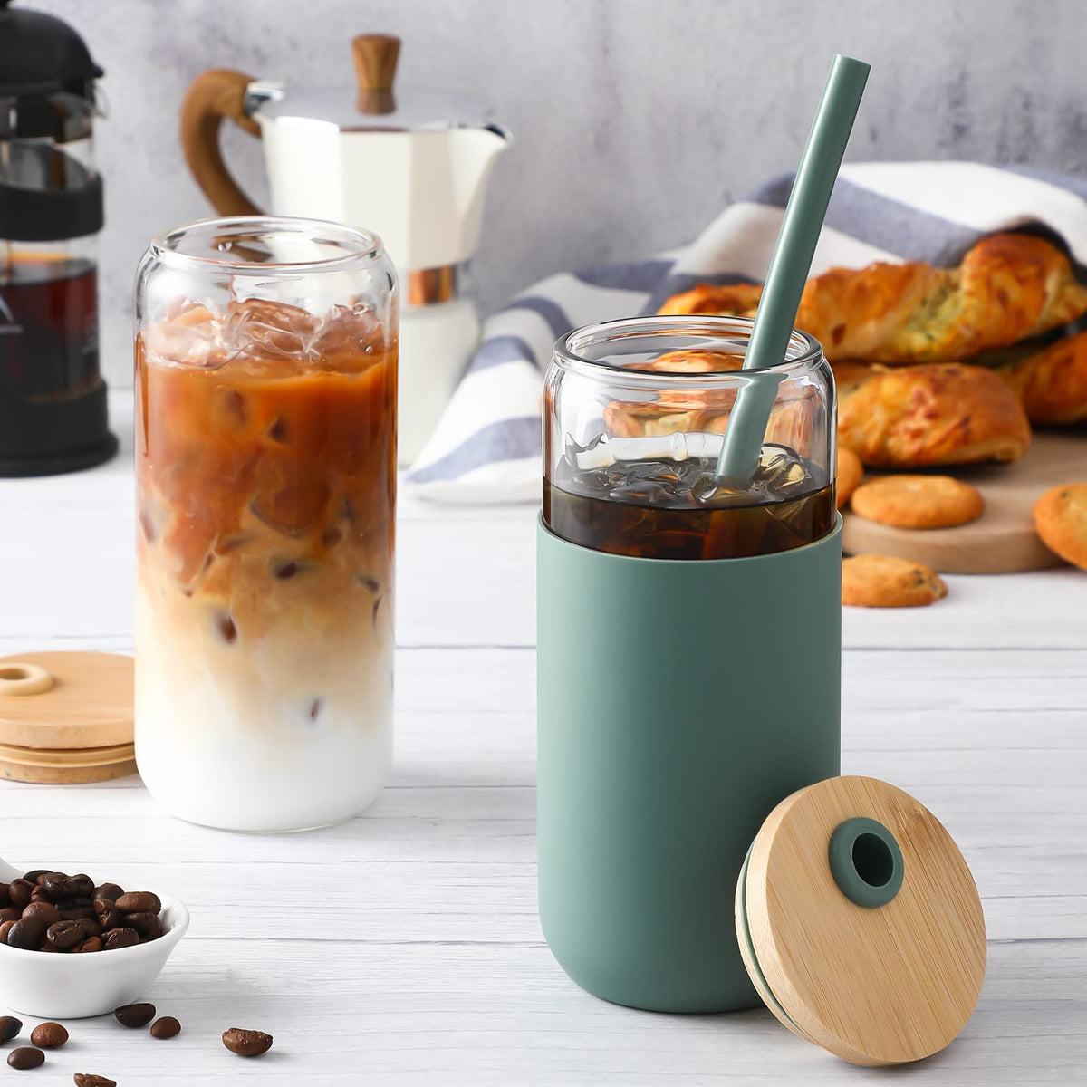 Beer-shaped glass cup with bamboo lid and silicone straw for easy sipping.