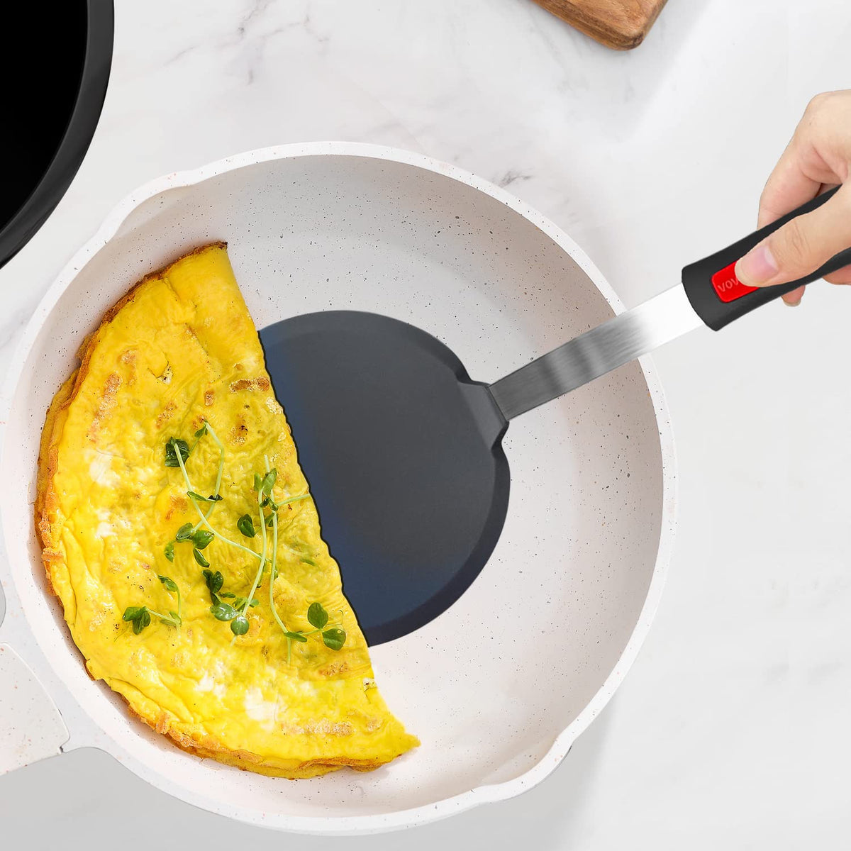 Vovoly spatula features a flexible thin blade that glides under food.