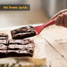Vovoly red spatula set on counter, vibrant kitchen essential.