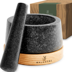 WALDWERK mortar and pestle with anti-scratch oak base protecting surfaces while grinding