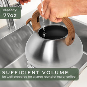 WALDWERK tea kettle on a gas stove with a durable steel body.