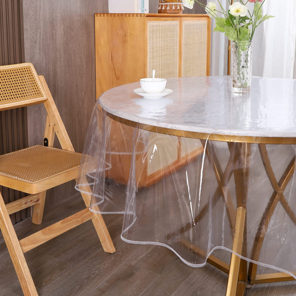 Walrus clear round tablecloth protector shows coverage on a dining table.