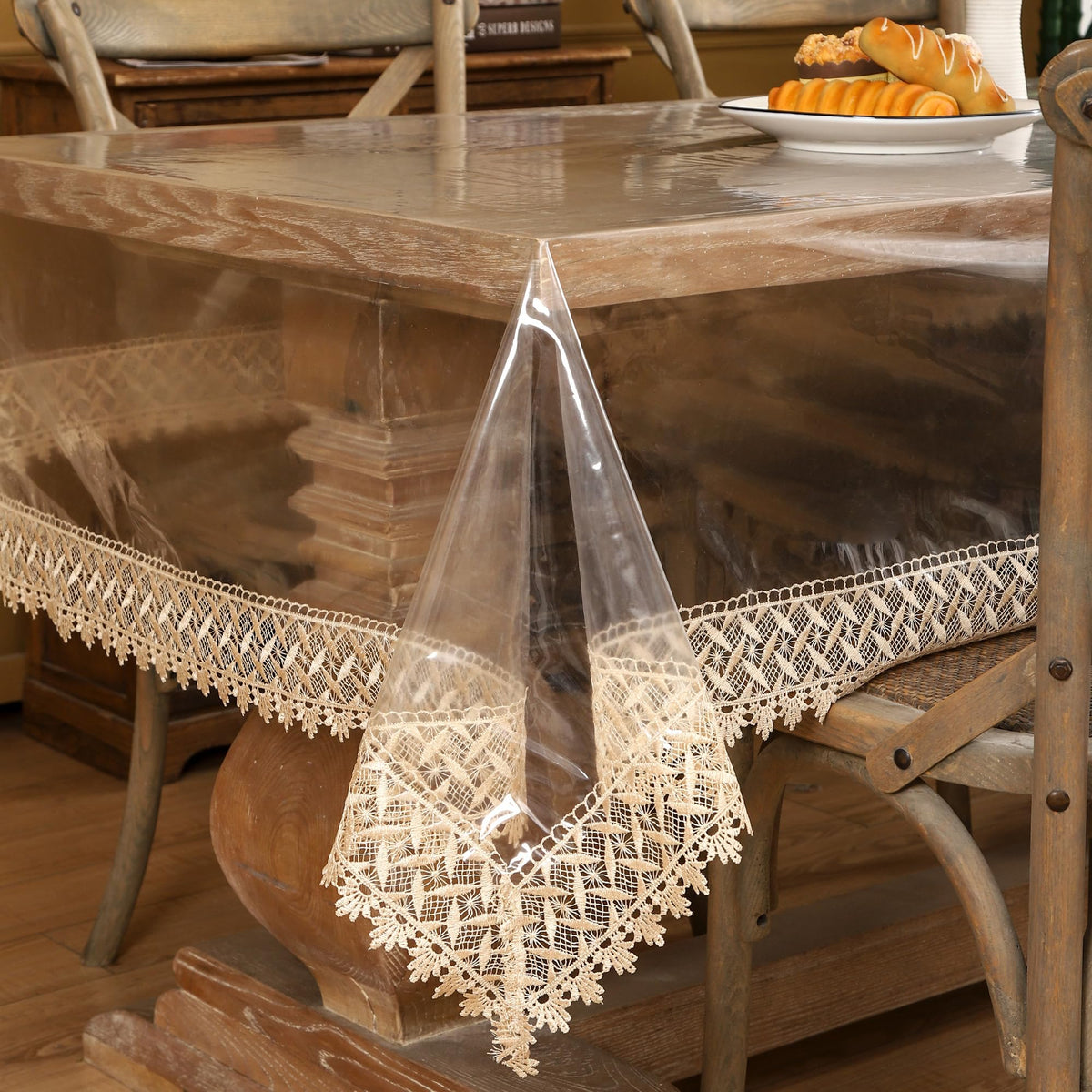 Walrus clear vinyl tablecloth protector with lace edge keeps surfaces clean and stylish.