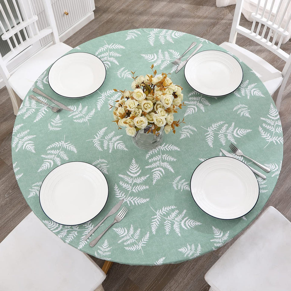 Walrus round vinyl fitted tablecloth with flannel backing protects surfaces and stays in place during meals.