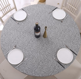 Walrus round vinyl fitted tablecloth with elastic edge keeps table protected during meals.