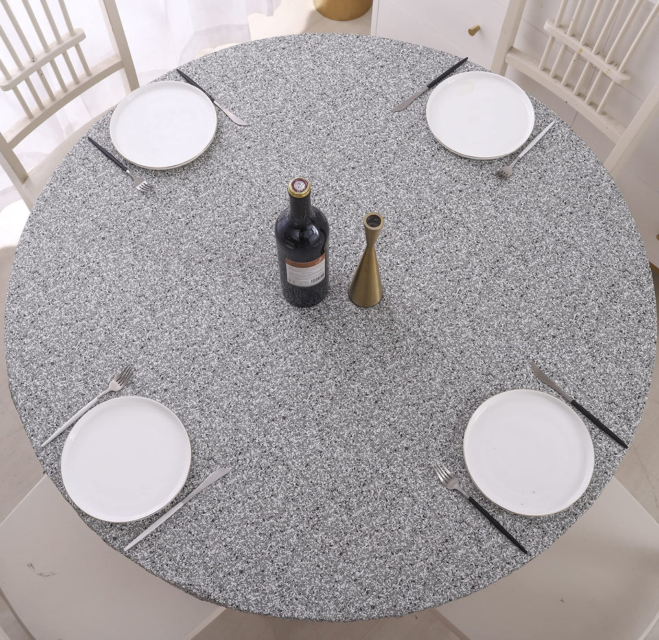Walrus round vinyl fitted tablecloth with elastic edge keeps table protected during meals.