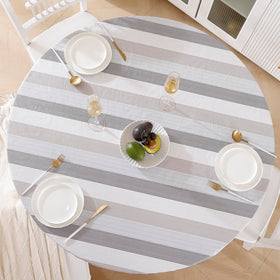 Walrus round vinyl tablecloth with flannel backing provides a snug, spill-resistant dining surface.