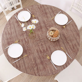 Walrus round vinyl tablecloth with flannel backing protects against spills during family dinners.