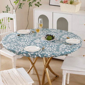 Walrus round vinyl tablecloth features oil-proof coating for easy cleanup.