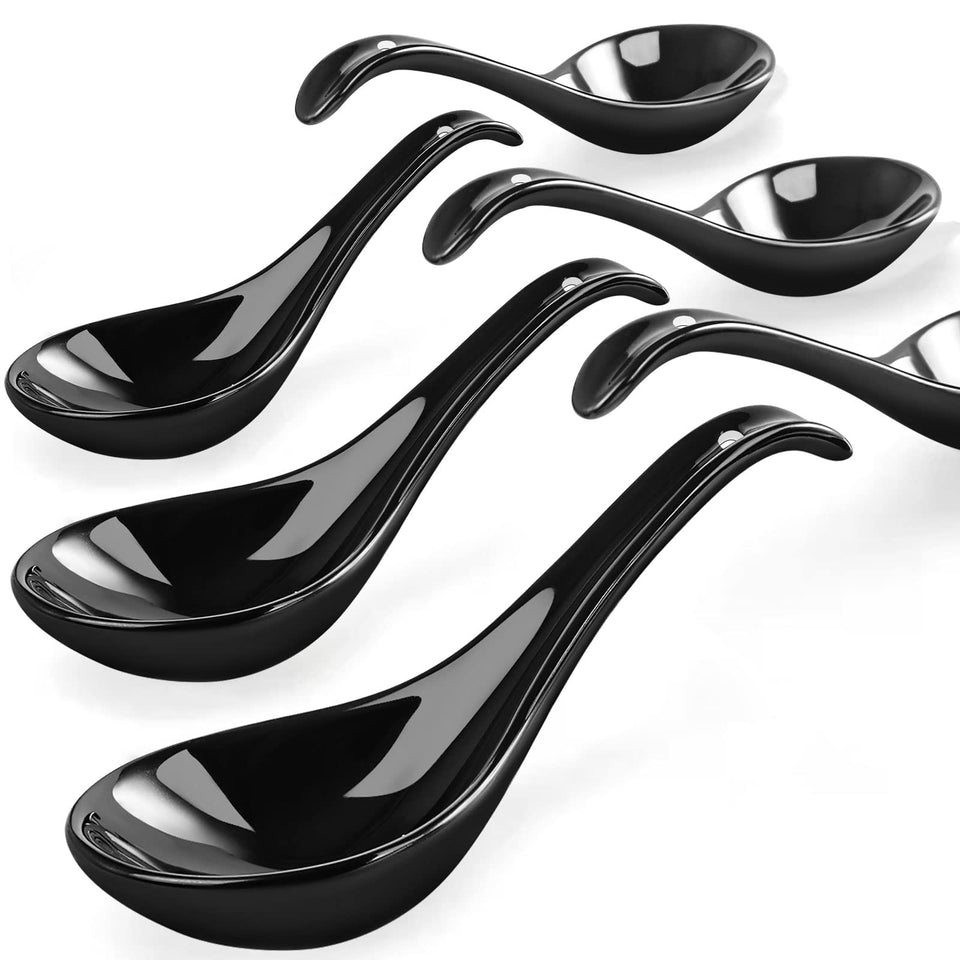 Wareland black ceramic soup spoon close-up showing deep oval bowl for rich broth