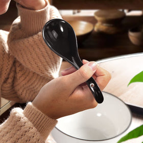 Dishwasher-safe Wareland spoon resting on clean dish rack