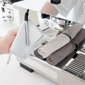 Watchget Barista microfiber cloths folded for tidy storage and spill cleanup.