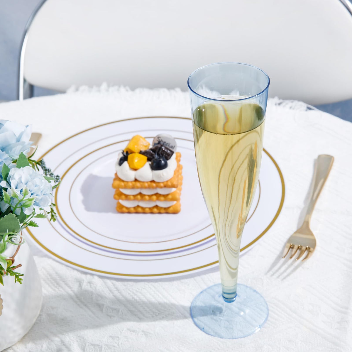WDF blue plastic champagne flutes stacked for easy storage.