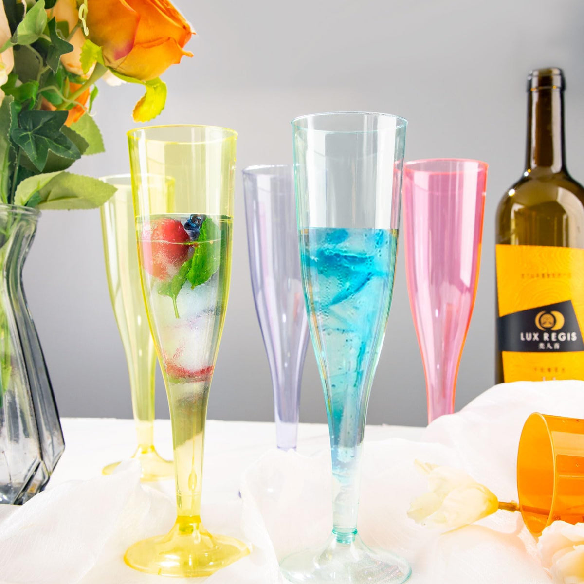 WDF blue champagne flute features shatterproof plastic for worry-free gatherings.