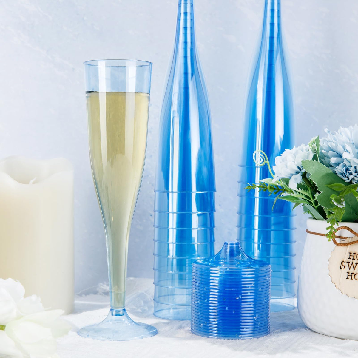 WDF blue champagne flutes in a party setting for easy disposal.
