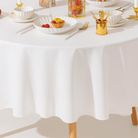 Wealuxe picnic party setup featuring a pristine white round tablecloth