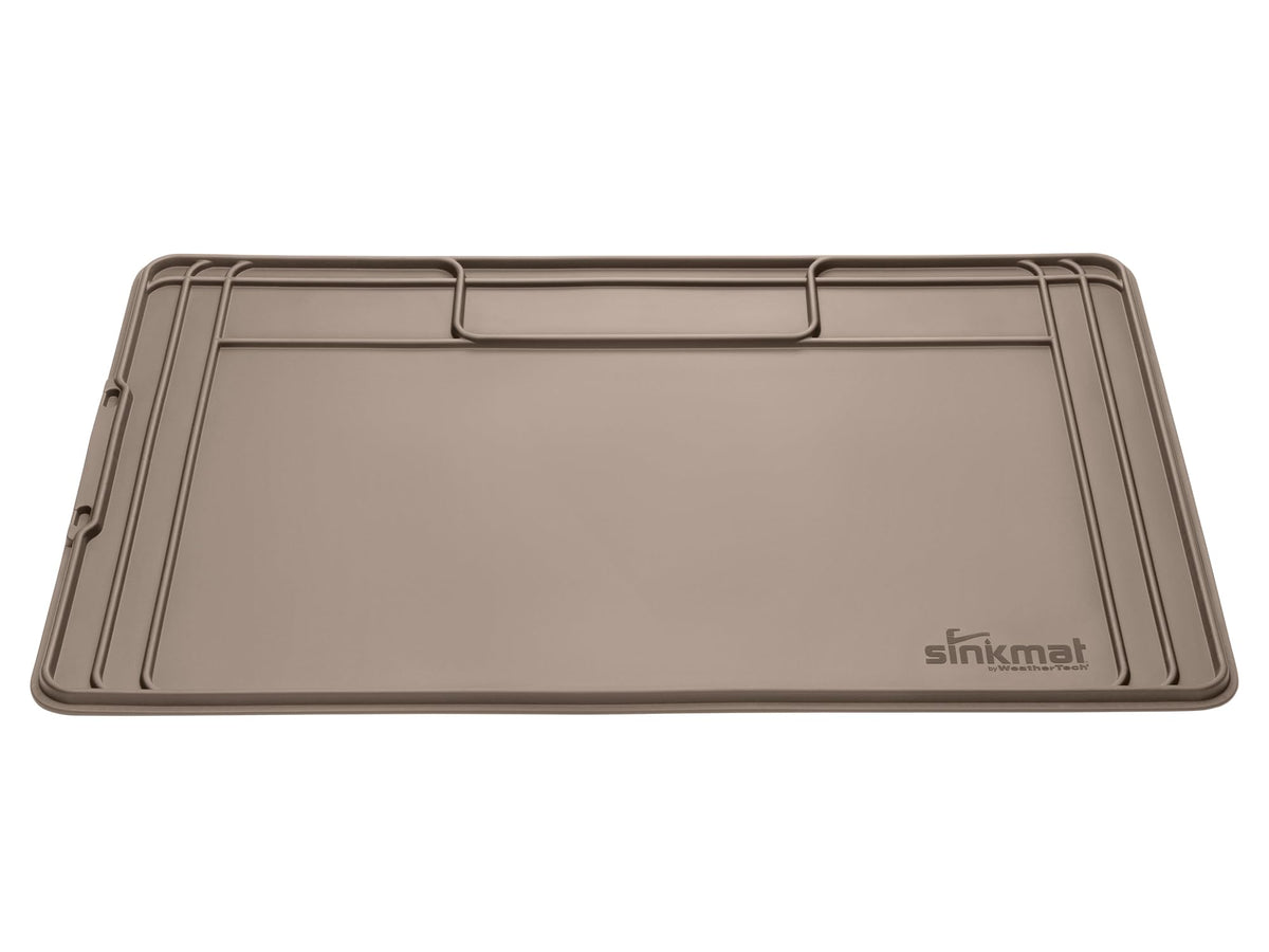 WeatherTech SinkMat with raised lip protects cabinets from under-sink leaks.