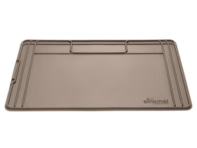 WeatherTech SinkMat with raised lip protects cabinets from under-sink leaks.