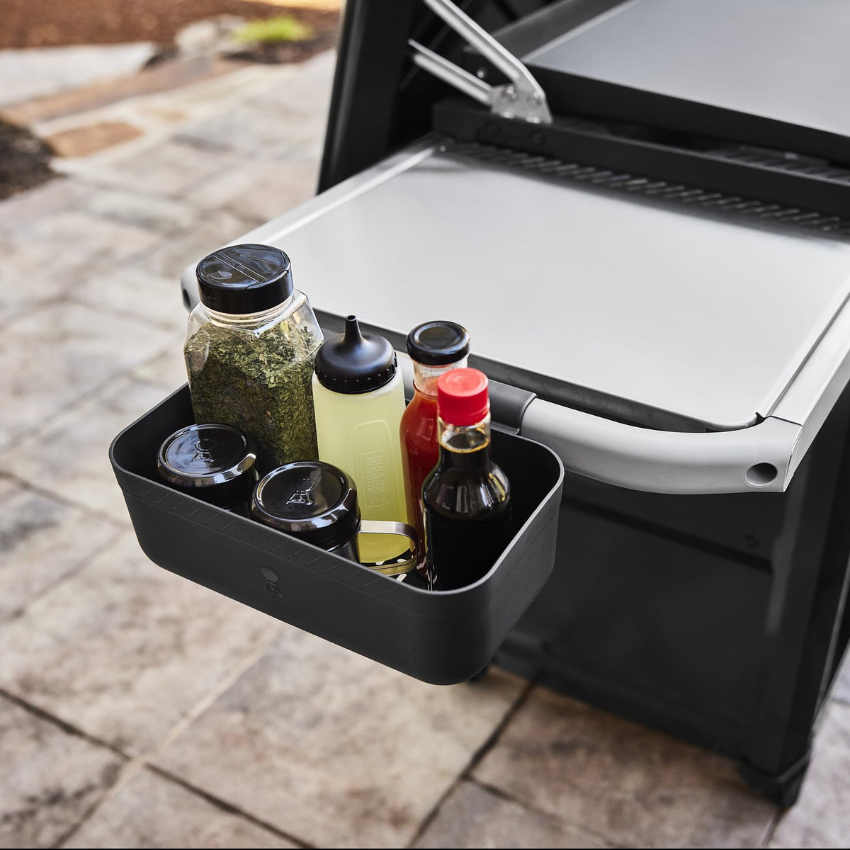 Keep side table clear with Weber Works Caddy during outdoor cooking