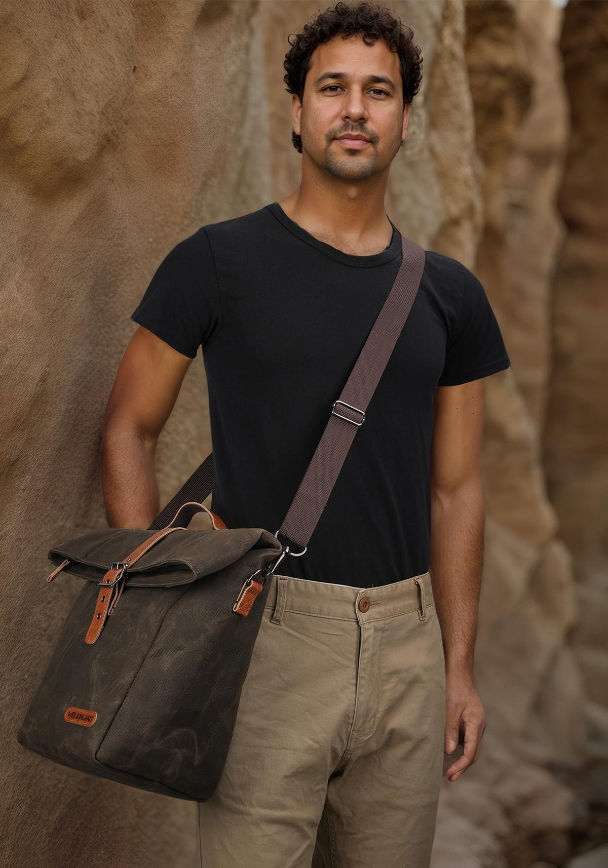 WELKINLAND waxed canvas lunch bag with leather accents and rugged zippers.