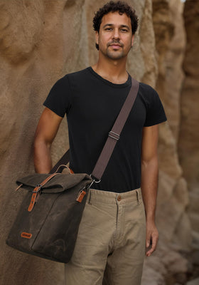 WELKINLAND waxed canvas lunch bag with leather accents and rugged zippers.