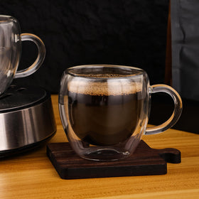 Wells clear espresso mugs highlight crema and layered coffee art.
