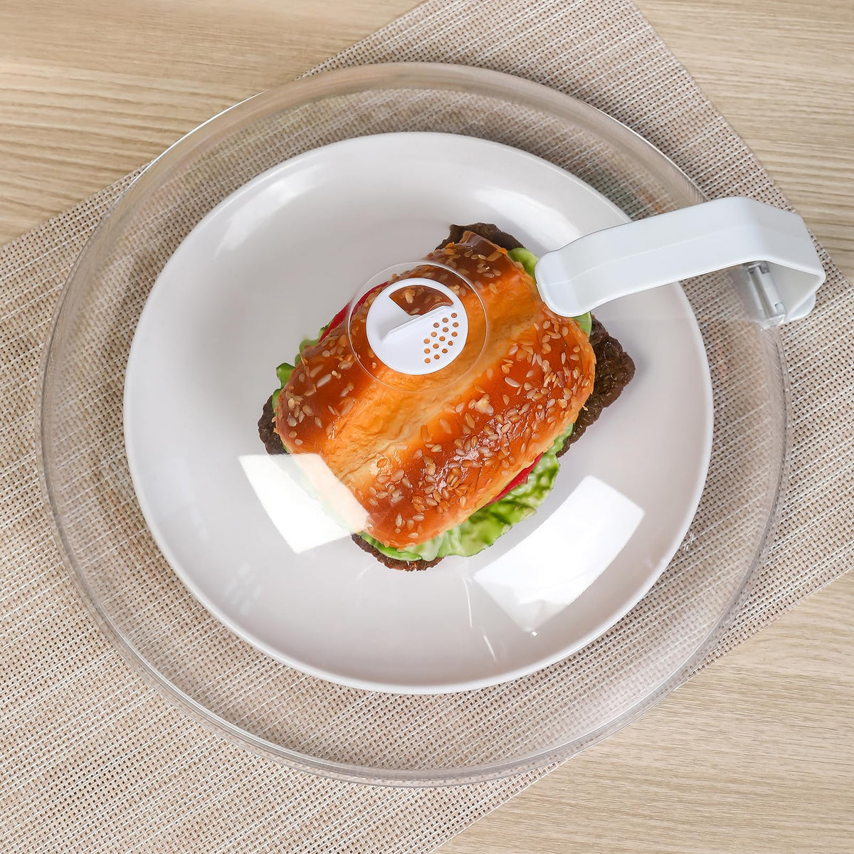 WENWELL 12-inch dome splatter cover shielding meals while staying clearly visible