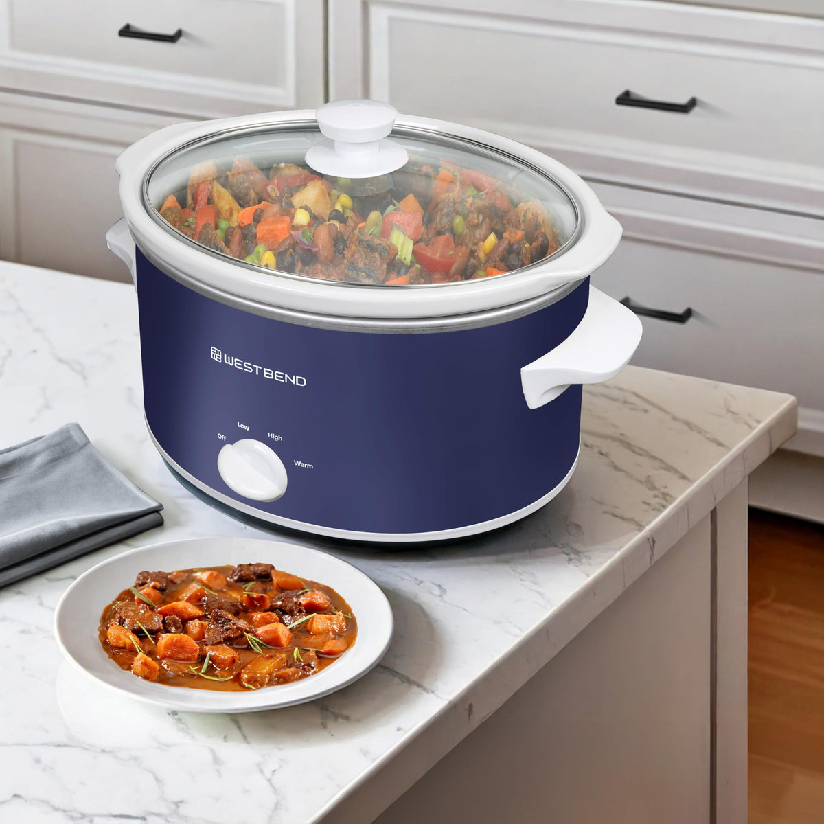 West Bend slow cooker serving-dish stoneware doubles as an elegant table centerpiece.