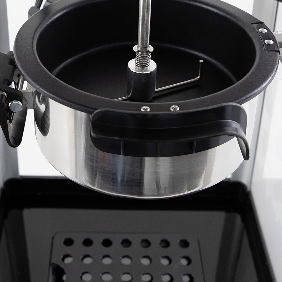 West Bend Stir Crazy Popcorn Maker includes scoop and measuring tools for prep.