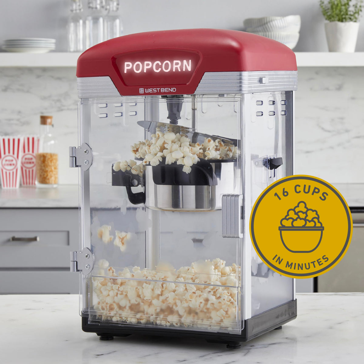 West Bend Stir Crazy Popcorn Maker magnetic kettle for easy filling and pouring.