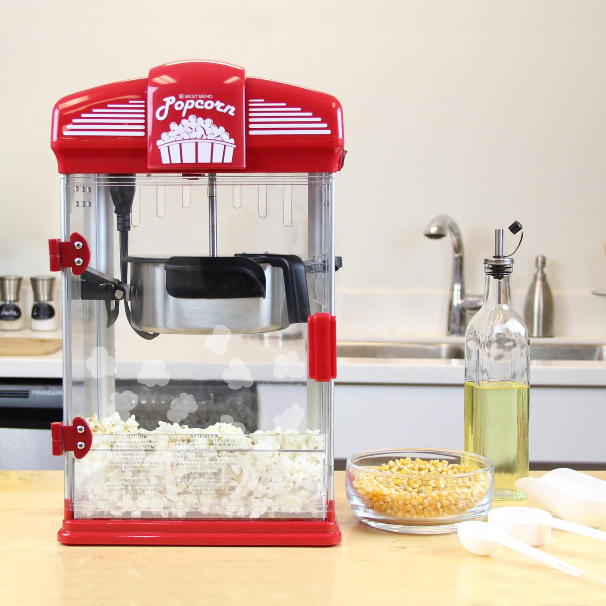 Tilt kettle with magnetic cover on West Bend popper