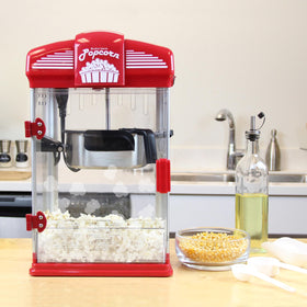 Tilt kettle with magnetic cover on West Bend popper