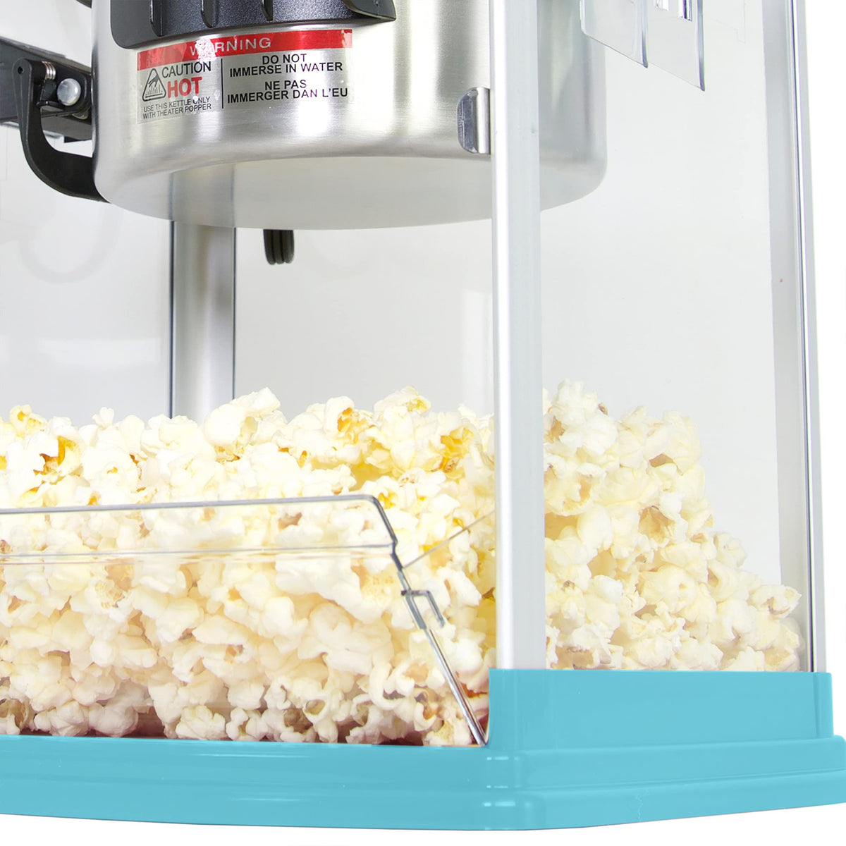 West Bend Stir Crazy tilt lever empties popcorn smoothly into serving area