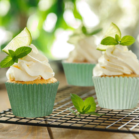 Whaline baby shower cupcake wrappers boost festive presentation.