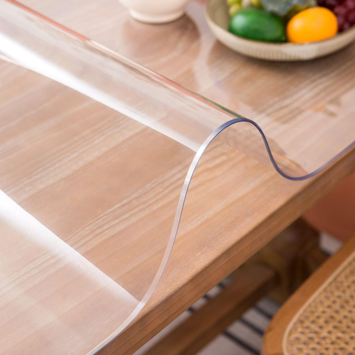 Whirltique clear table cover on a 24x48 surface protects while staying nearly invisible