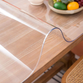 Whirltique clear table cover on a 24x48 surface protects while staying nearly invisible
