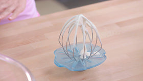 Whisk Wiper PRO red cleans bowl contours for a tidy wipe.
