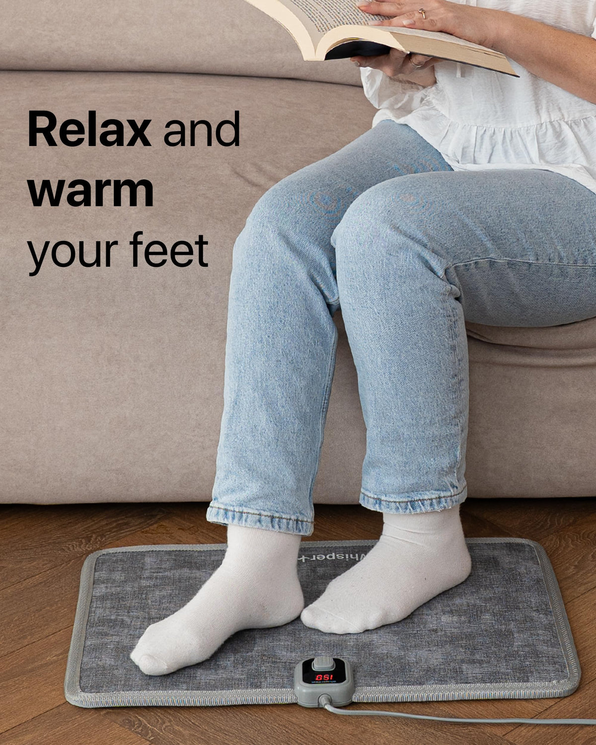 WhisperHeat under-desk heat pad warming your feet during work.