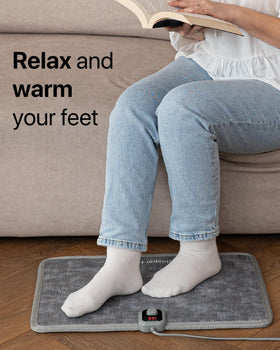 WhisperHeat under-desk heat pad warming your feet during work.