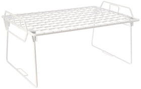 Whitmor Wire Grid Stacking Utility Shelf shown during assembly, adding kitchen storage.