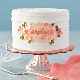 Wilton 8in round pan with 3in sides supports tall wedding cake layers.