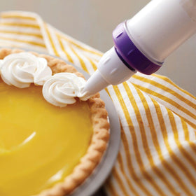 Wilton Dessert Decorator Plus two couplers for versatile decorating.