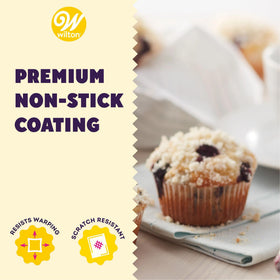Extended handles on Wilton muffin pan for secure handling with oven mitts