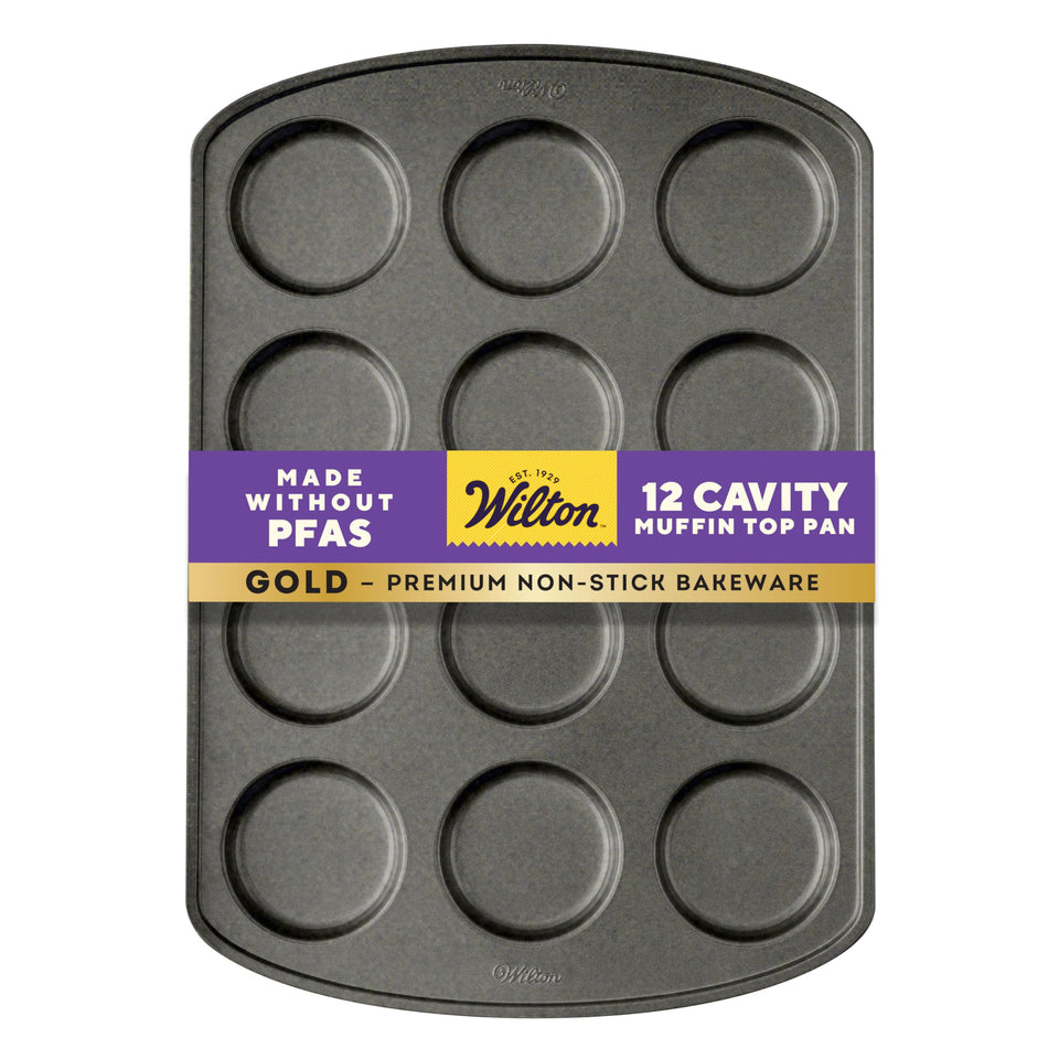 Wilton Gold non-stick muffin top pan with 12 cavities for even baking.