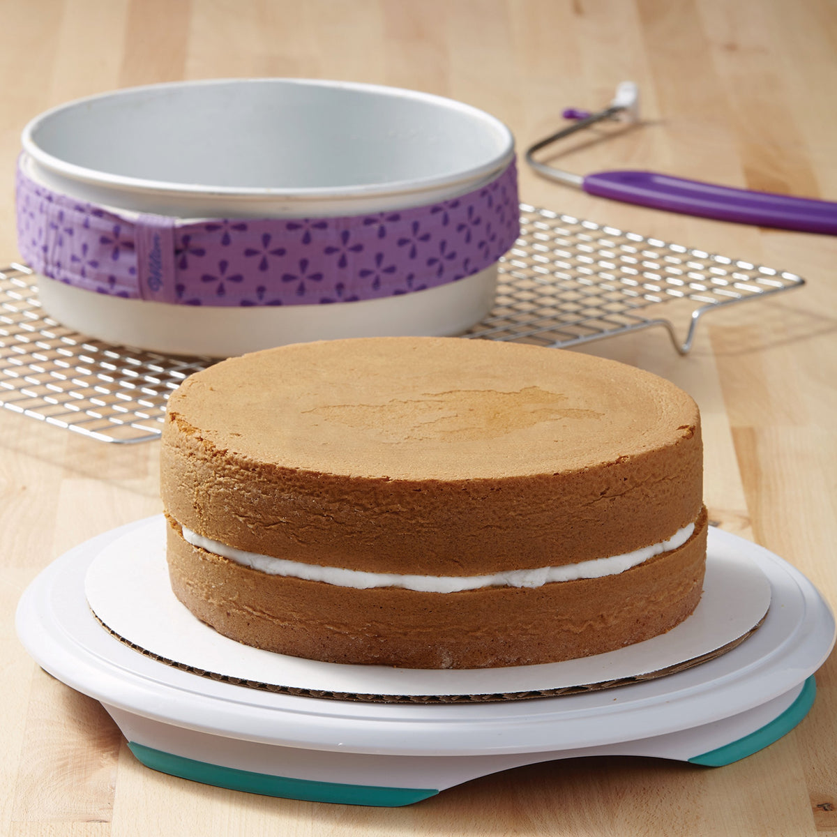 Wilton 9-inch round cake pan edge close-up highlights durable anodized aluminum