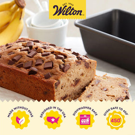 Wilton Platinum loaf pan side view highlighting extended handles for easy handling.